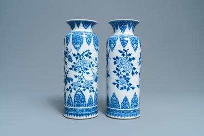 A pair of Chinese blue and white vases with floral designs, Kangxi