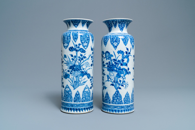 A pair of Chinese blue and white vases with floral designs, Kangxi