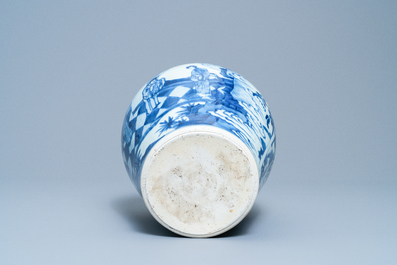 Een Chinese blauw-witte vaas met figuren in een interieur, Kangxi