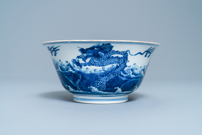 A Chinese blue and white 'dragon and carps' bowl, Xuande mark, Kangxi