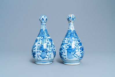 A pair of Chinese blue and white 'garlic head' bottle vases, Wanli