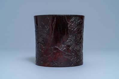 A Chinese carved zitan wood brush pot with a mountainous landscape, 17/18th C.