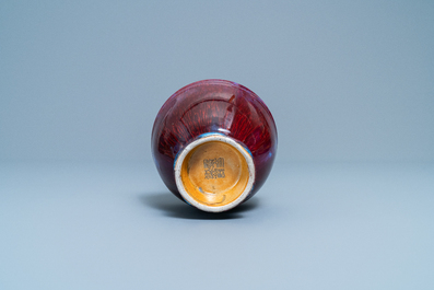 A Chinese monochrome flamb&eacute;-glazed vase, incised Qianlong mark, 18/19th C.