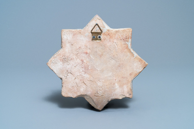 A star-shaped luster-glazed tile, Kashan, Iran, 14th C.