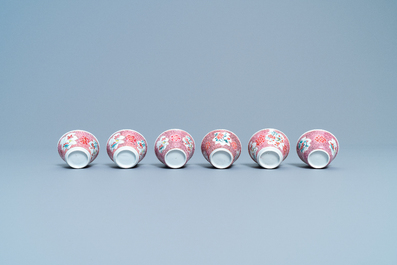 Six Chinese famille rose cups and saucers with a lady and a boy, Yongzheng/Qianlong