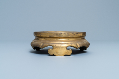 A Chinese gilt bronze stand, 19th C.
