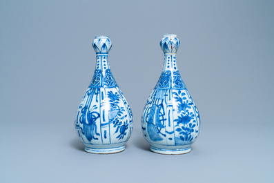 A pair of Chinese blue and white 'garlic head' bottle vases, Wanli