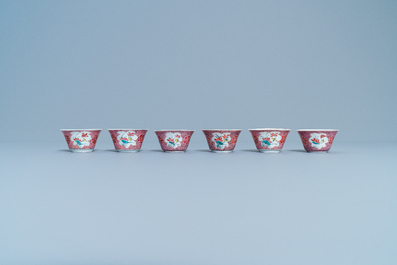 Six Chinese famille rose cups and saucers with a lady and a boy, Yongzheng/Qianlong