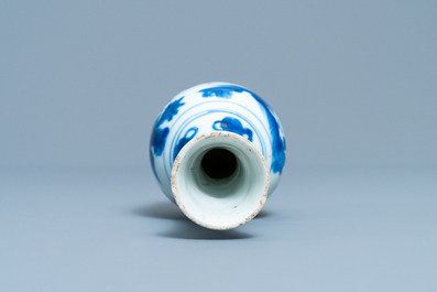 A Chinese blue and white bottle vase with figures in a landscape, Transitional period