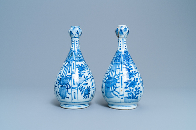 A pair of Chinese blue and white 'garlic head' bottle vases, Wanli