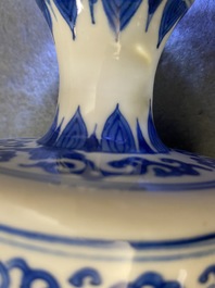 A pair of Chinese blue and white vases and covers, Kangxi