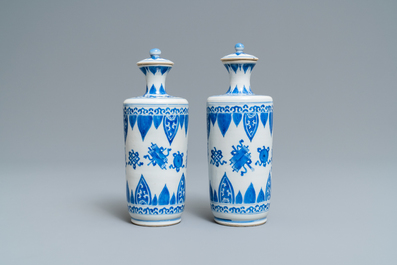 A pair of Chinese blue and white vases and covers, Kangxi