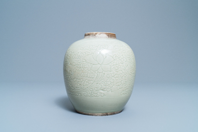 A Chinese monochrome celadon jar with underglaze lotus design, Kangxi