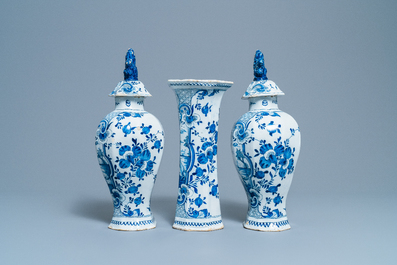 A Dutch Delft blue and white three-piece vase garniture with a dog, 18th C.