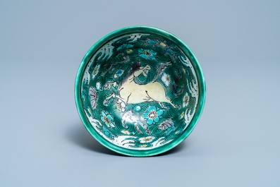 A Chinese verte biscuit bowl with horses, Kangxi