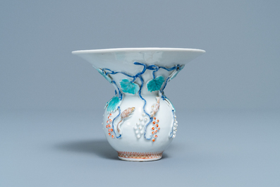 A Chinese relief-decorated 'squirrel and grapevine' spittoon, Yongzheng