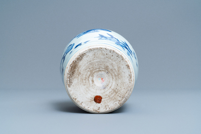 A Chinese blue and white bottle vase with floral design, Transitional period