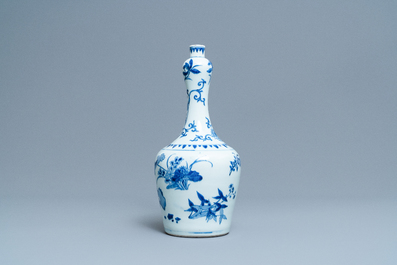 A Chinese blue and white bottle vase with floral design, Transitional period