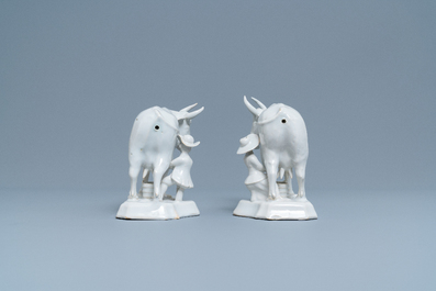 A pair of white Dutch Delftware groups of cows with milkers, 18th C.