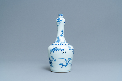 A Chinese blue and white bottle vase with floral design, Transitional period