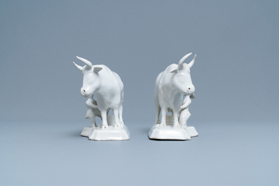 A pair of white Dutch Delftware groups of cows with milkers, 18th C.