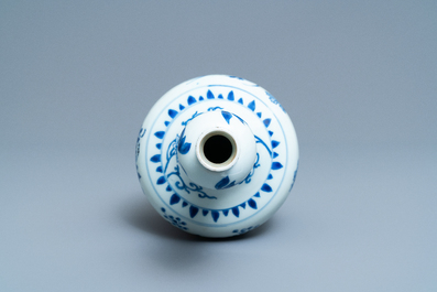 A Chinese blue and white bottle vase with floral design, Transitional period