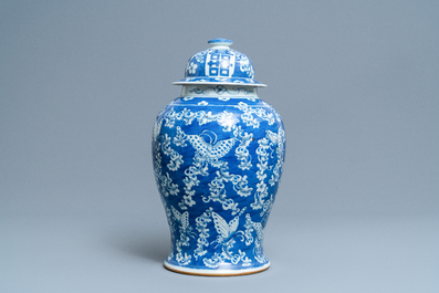 A Chinese blue and white 'butterfly' vase and cover, 19th C.