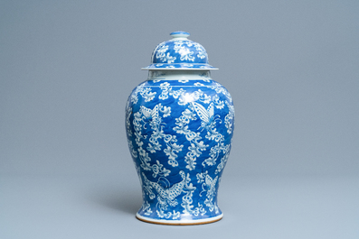 A Chinese blue and white 'butterfly' vase and cover, 19th C.