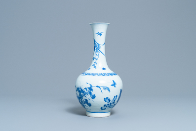 A rare Chinese blue and white bottle vase with a cat and a butterfly, Transitional period