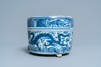 A Chinese blue and white 'dragon' tripod censer, Ming