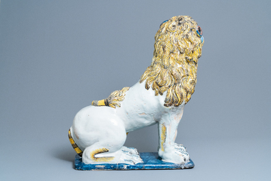 A pair of monumental polychrome Rouen faience models of lions, France, 18th C.