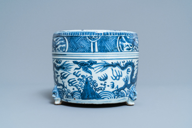 A Chinese blue and white 'dragon' tripod censer, Ming