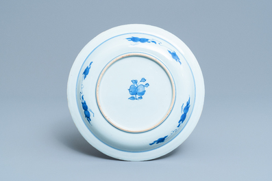 A Chinese blue and white dish with two figures in a garden, Transitional period