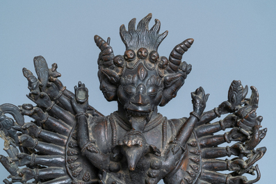 A Tibetan bronze group of Mahakala and his consort Yab-Yum, 19th C.