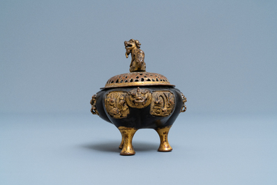 A Chinese lacquered and parcel-gilt bronze tripod censer and cover, Ming