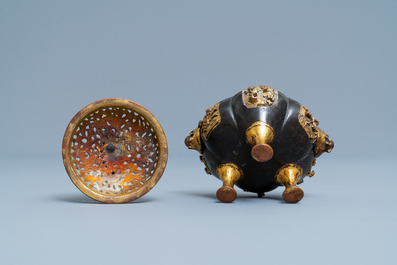 A Chinese lacquered and parcel-gilt bronze tripod censer and cover, Ming