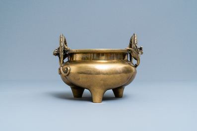 A Chinese bronze chilong-handled tripod censer, seal mark, 17/18th C.