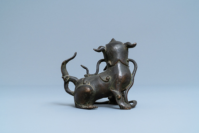 A Chinese bronze model of a Buddhist lion, late Ming