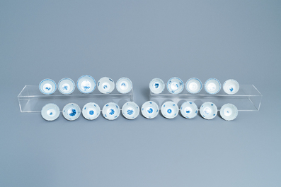 Twenty Chinese blue and white cups and twenty-four saucers, Kangxi