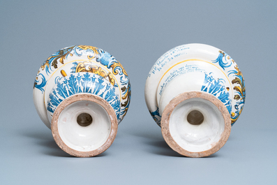 An important pair of large inscribed Italian maiolica drug jars and covers, Naples, dated 1724