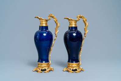 A pair of Chinese gilt bronze ewer-mounted monochrome blue vases, 18/19th C.