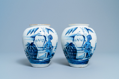 A pair of Dutch Delft blue and white tobacco jars with indians, 18th C.