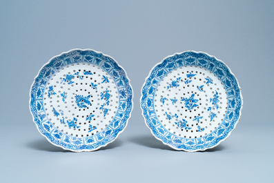 A pair of Dutch Delft blue and white strawberry strainers on stands, 18th C.