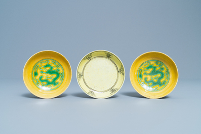 Three Chinese yellow-ground saucer dishes, 19/20th C.