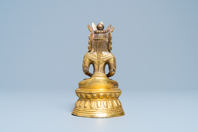 A Sino-Tibetan gilt bronze figure of Buddha, 18th C.