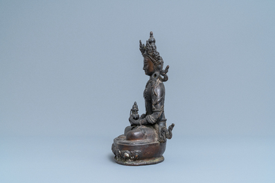 A Sino-Tibetan gilt bronze figure of Buddha, 19th C.