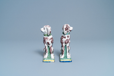 A pair of polychrome Dutch Delft money banks modelled as dogs, 18th C.