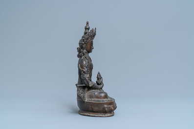 A Sino-Tibetan gilt bronze figure of Buddha, 19th C.