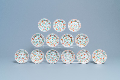 Eleven Chinese famille verte cups and thirteen saucers, Kangxi