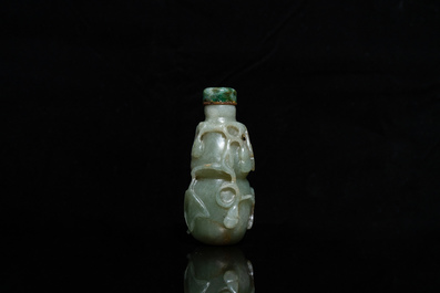 A Chinese gourd-shaped celadon and russet jade snuff bottle, Qing